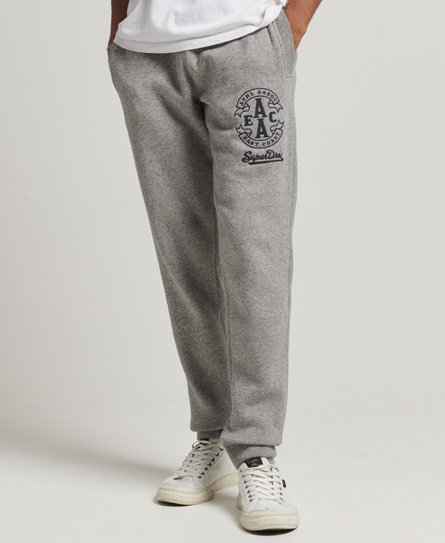 Smale College-joggebukser med logo og mansjetter rundt anklene