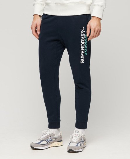Sportswear joggingbyxor med logga och avsmalnande ben