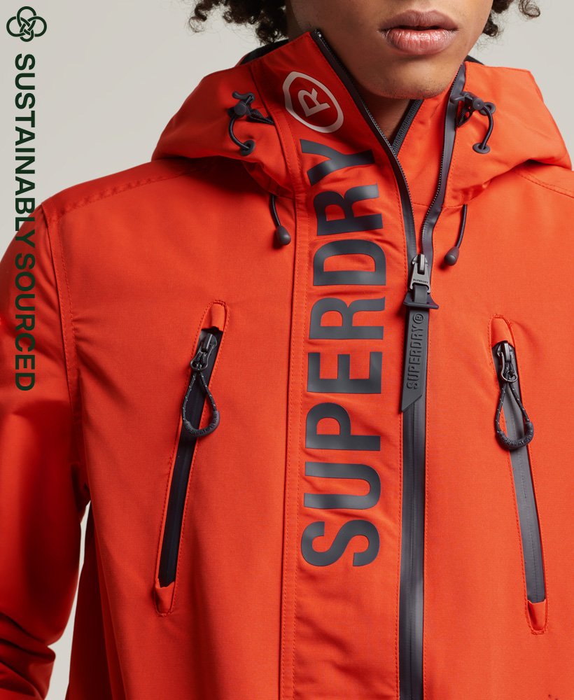 Hombre – Chaqueta cortavientos SD Ultimate en Naranja Intenso/azul