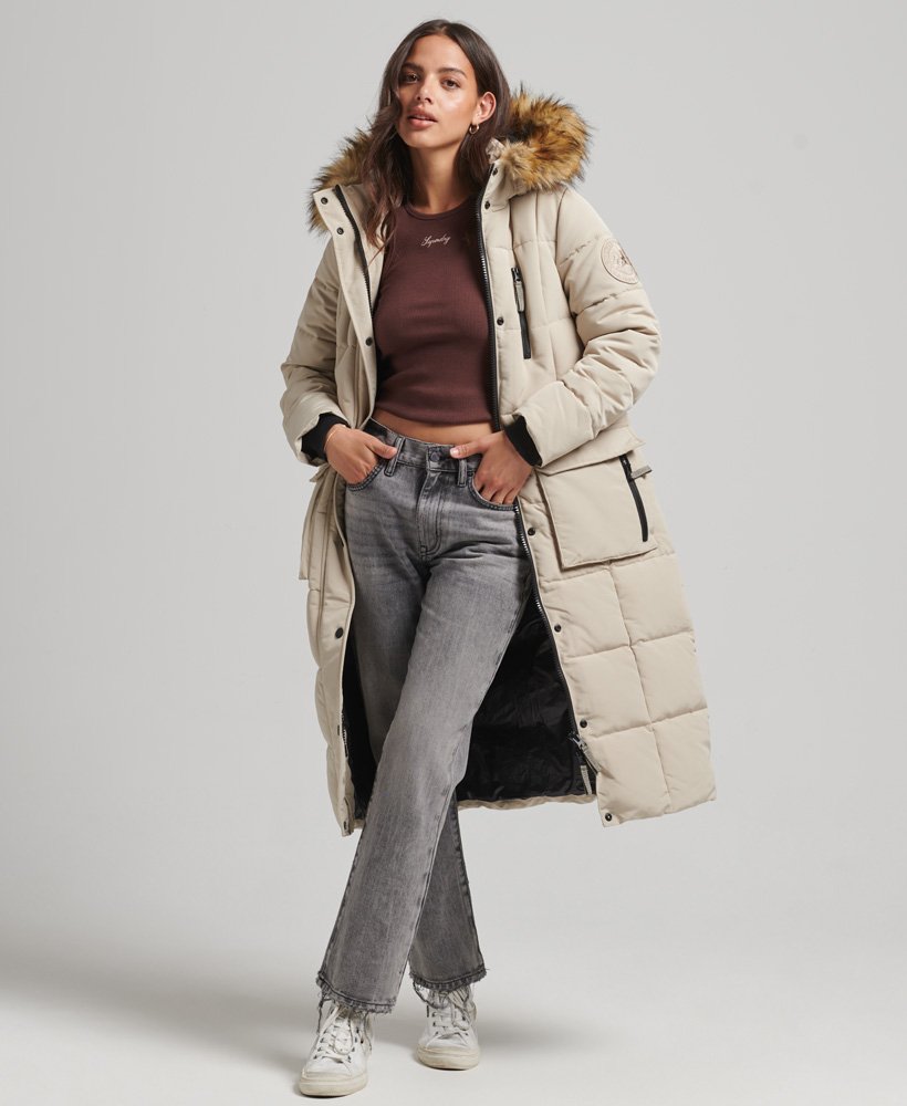 Long beige puffer coat with faux fur trimming