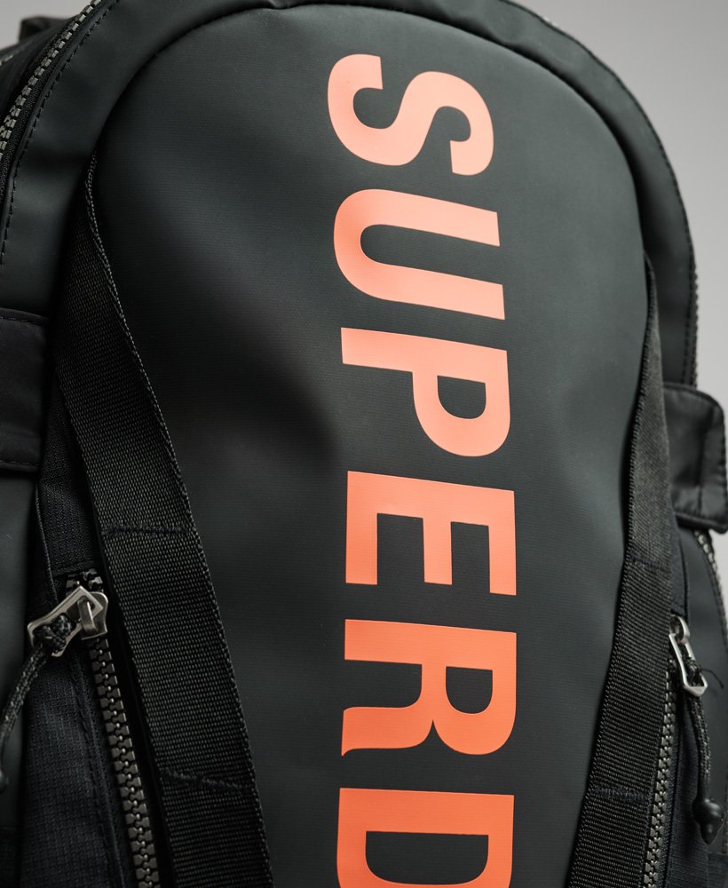 Superdry black and orange backpack sale